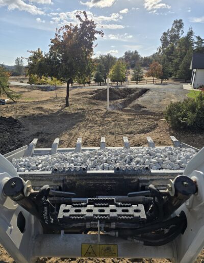 Installation of RV valves and rock leach line addition, showing the setup of leach lines with rocks and valve connections