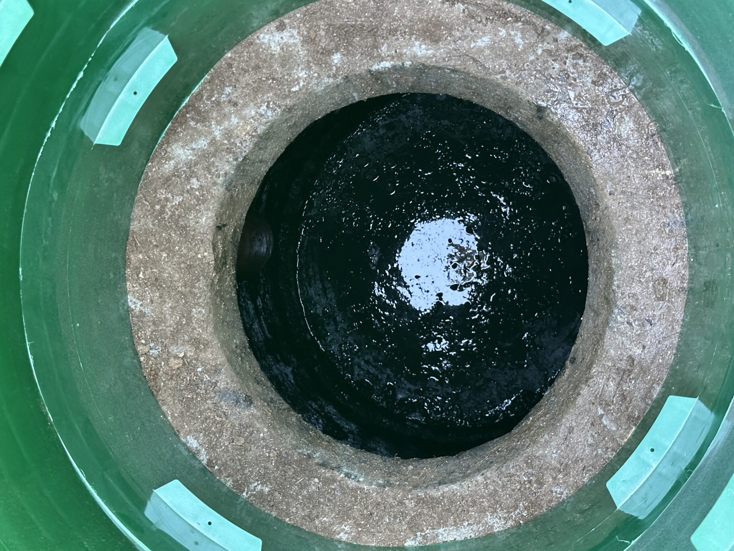 Cleaned septic tank after removing root intrusion, showing a clear and restored tank interior