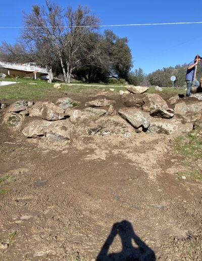 Grading level 4 illustration, showing a moderately steep slope with grading equipment adjusting the terrain