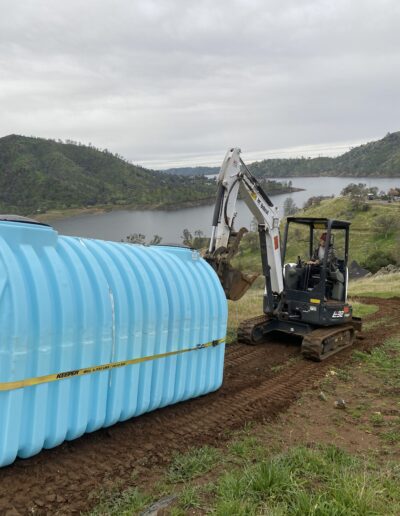 Tank replacement process, showing the removal of the old tank and preparation for installation of a new one